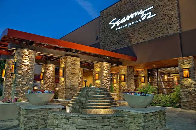 May Luncheon at Seasons 52 β Fresh Grill & Networking Seasons 52 restaurant exterior at night, venue for the May Luncheon