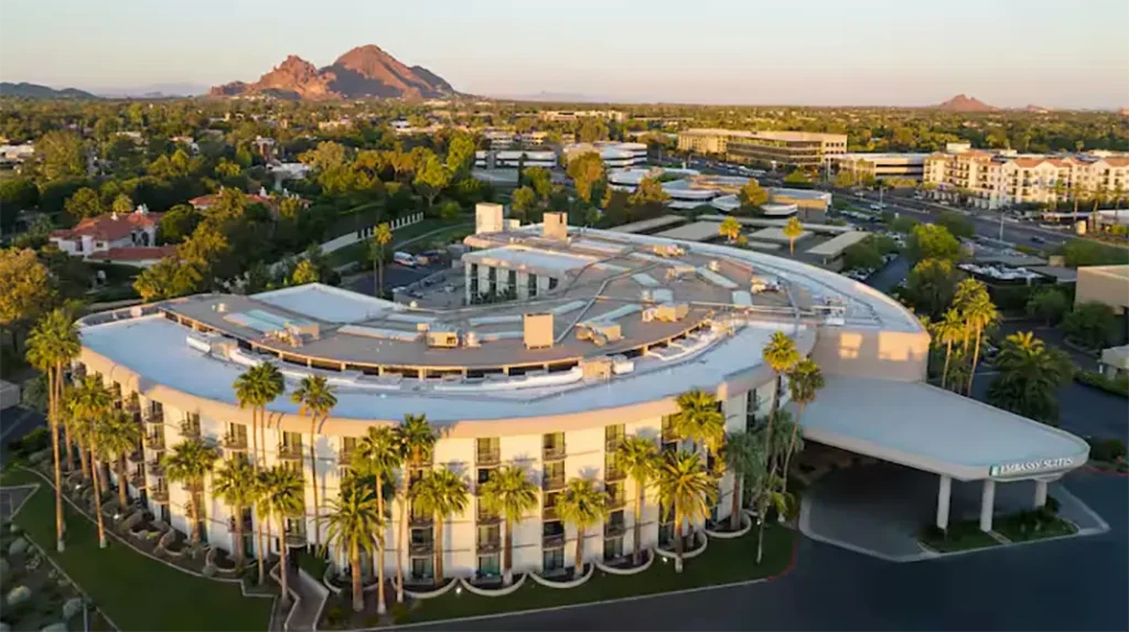 Aerial view of Embassy Suites Biltmore in Phoenix, Arizona, with Camelback Mountain in the background &mdash; venue for the Biltmore Area Partnership monthly luncheons.